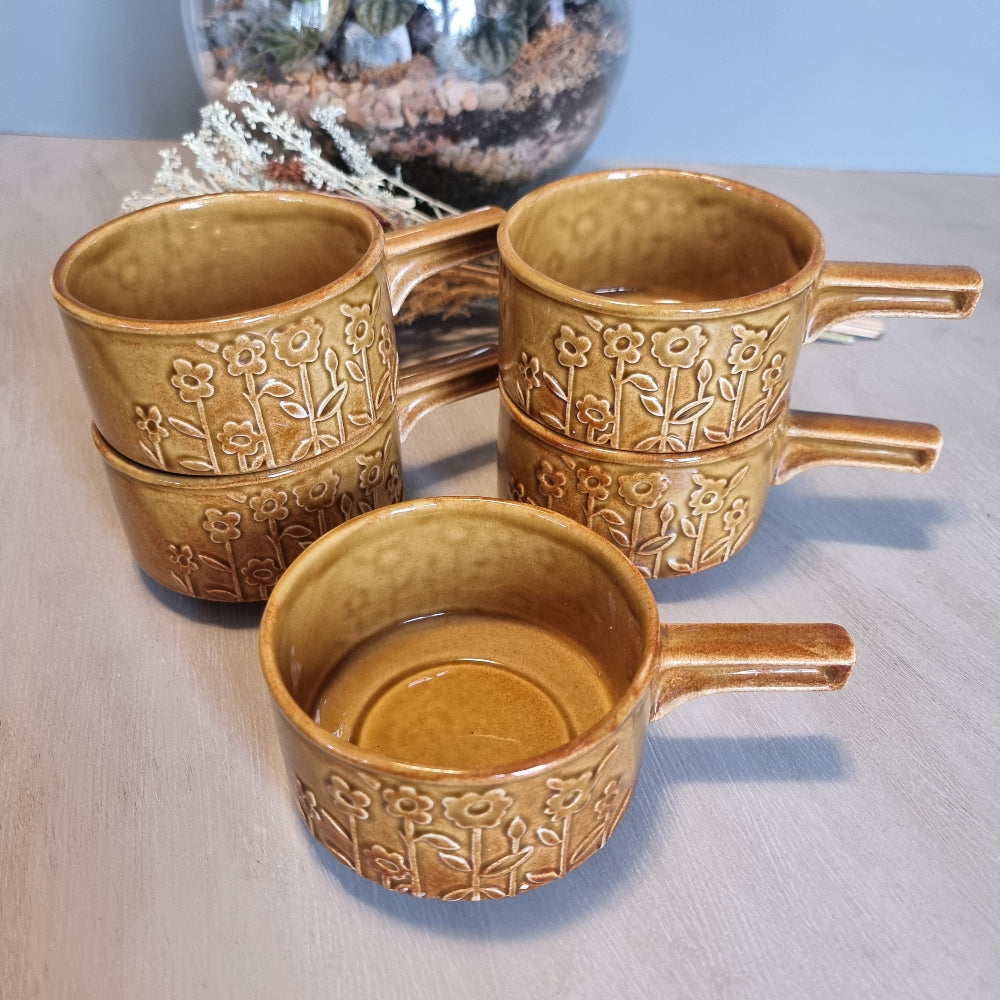 Set of 5 Crown Lynn brown soup bowls with embossed floral design and handles.