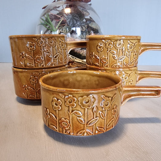 Set of 5 Crown Lynn brown soup bowls with embossed floral design and handles.