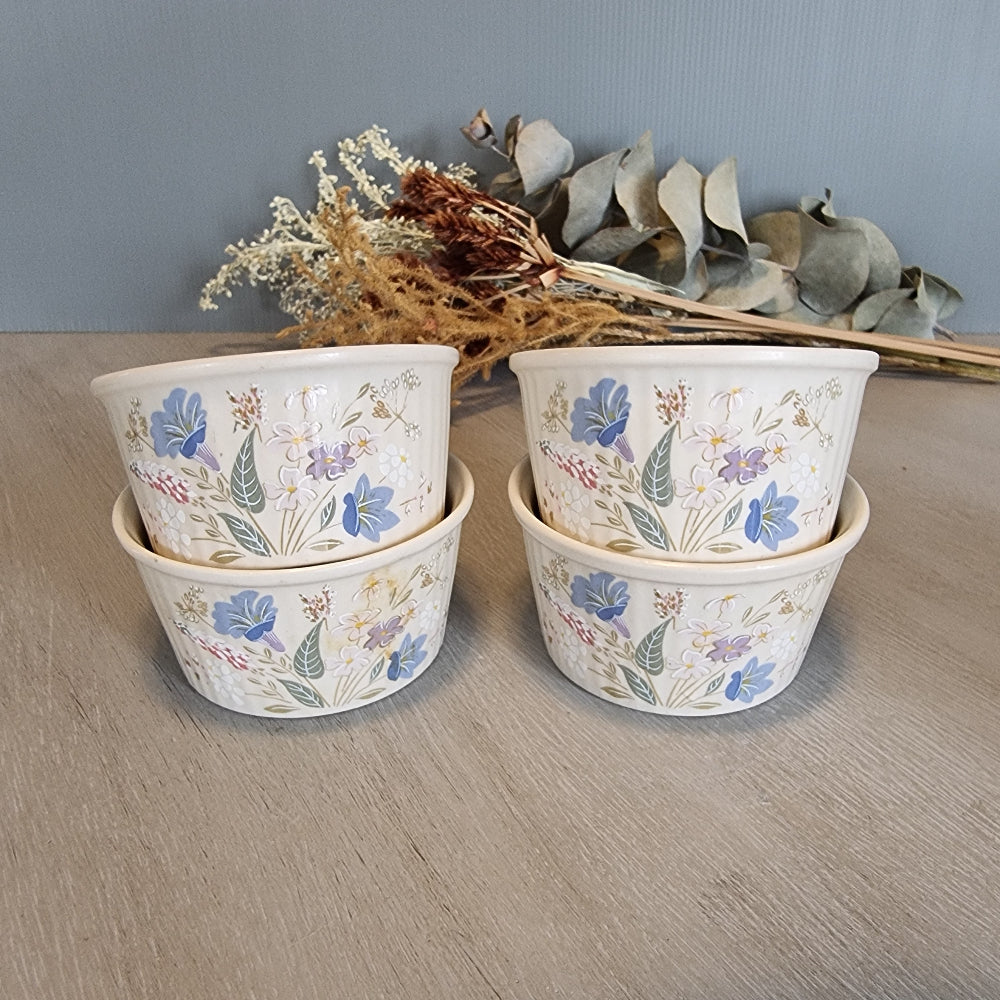 Set of 4 Poole Pottery Springtime bowls with pastel floral decoration.