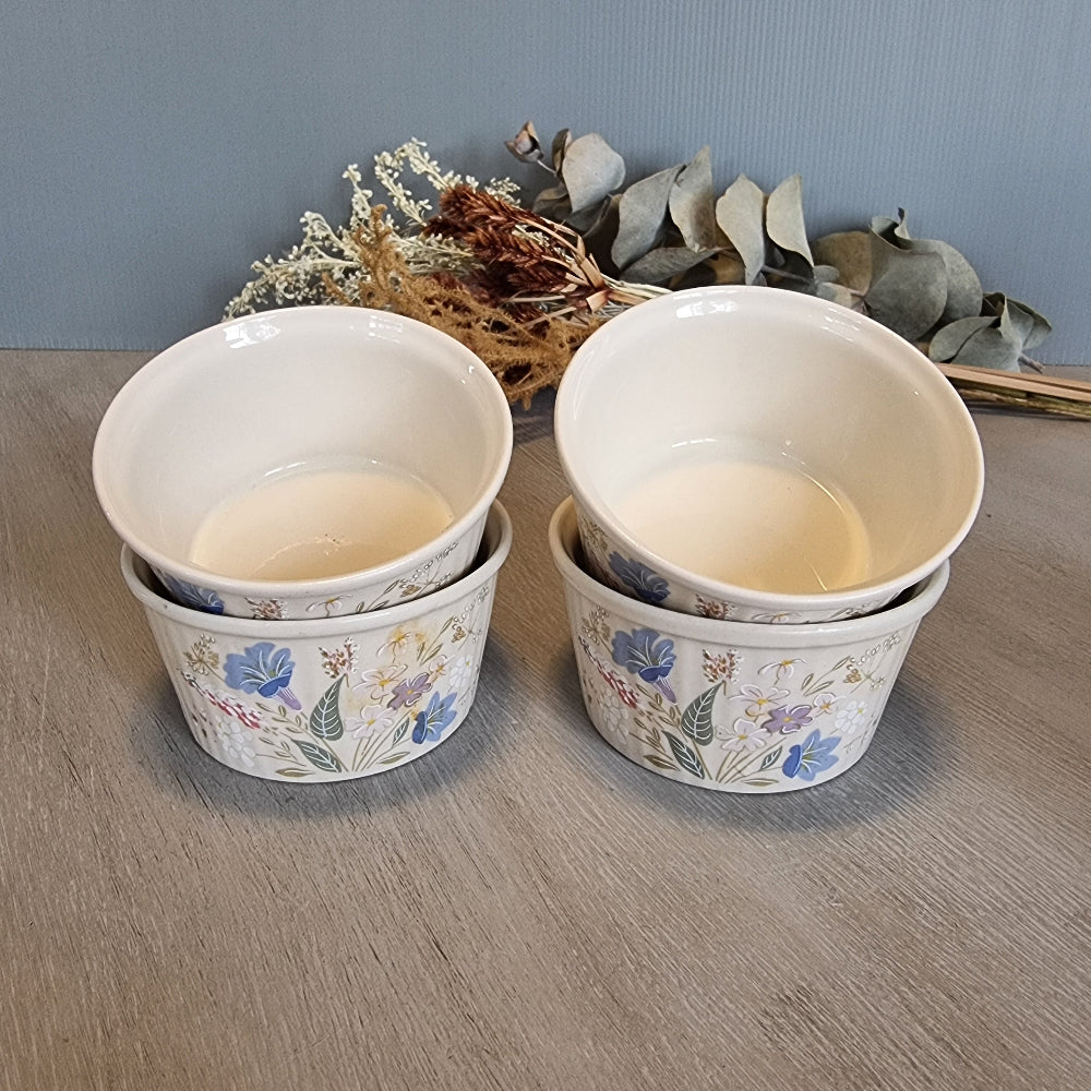 Set of 4 Poole Pottery Springtime bowls with pastel floral decoration.