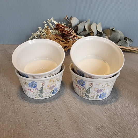 Set of 4 Poole Pottery Springtime bowls with pastel floral decoration.