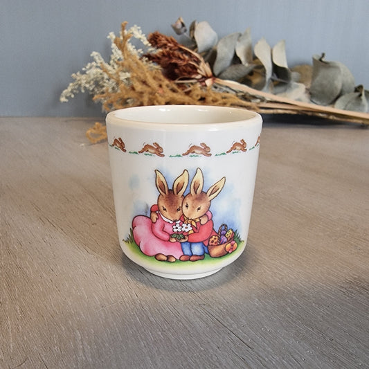 Royal Doulton Bunnykins egg cup with rabbit countryside scene.
