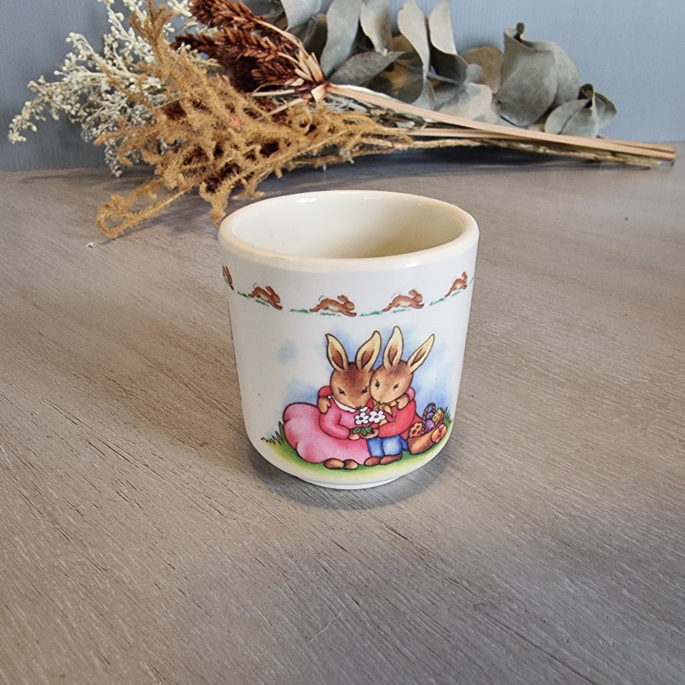Royal Doulton Bunnykins egg cup with rabbit countryside scene.