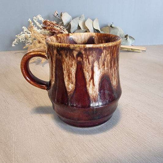 Crown Lynn drip glaze mug in brown and cream tones.