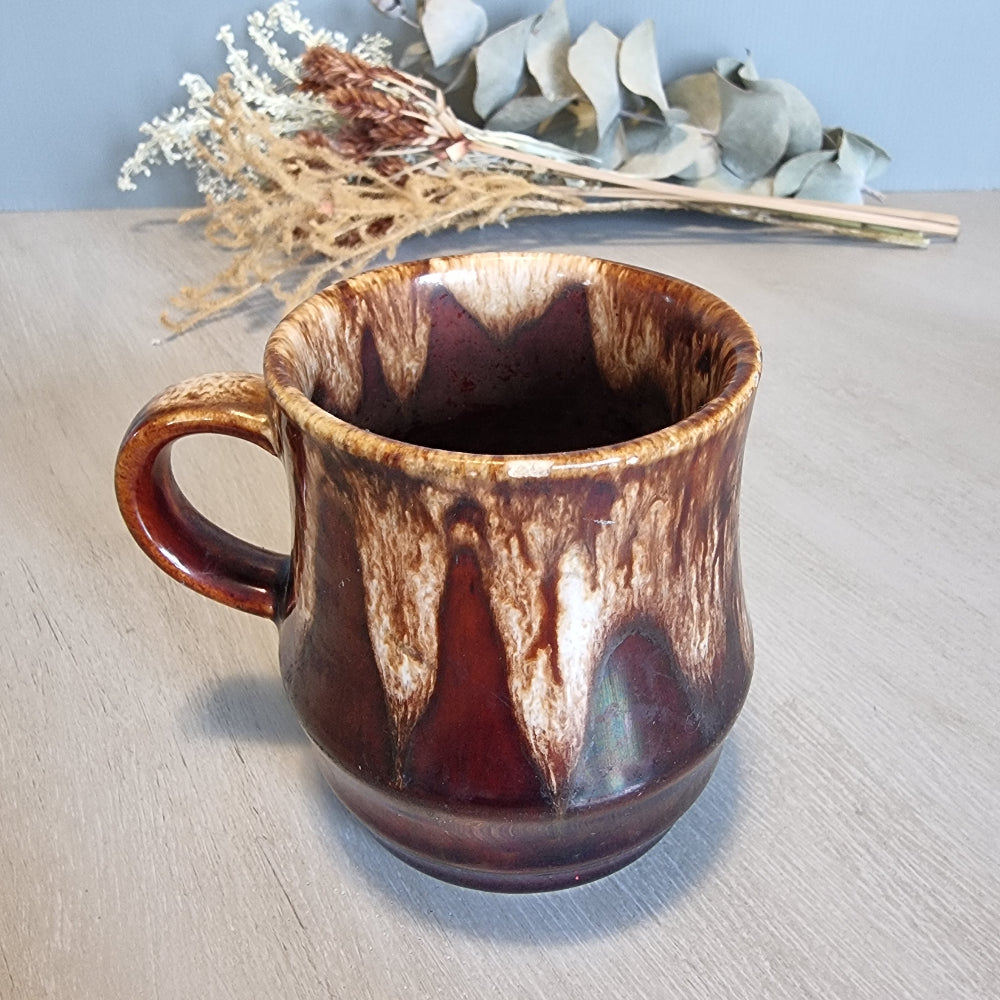 Crown Lynn drip glaze mug in brown and cream tones.