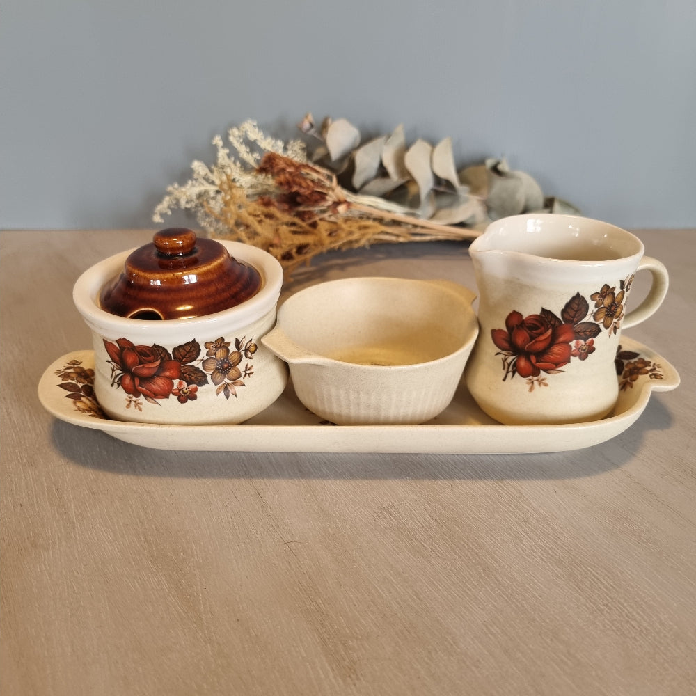 Vintage floral ceramic tea set with tray, jug, bowl and lidded pot.