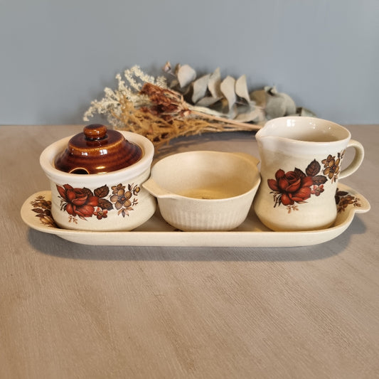 Vintage floral ceramic tea set with tray, jug, bowl and lidded pot.