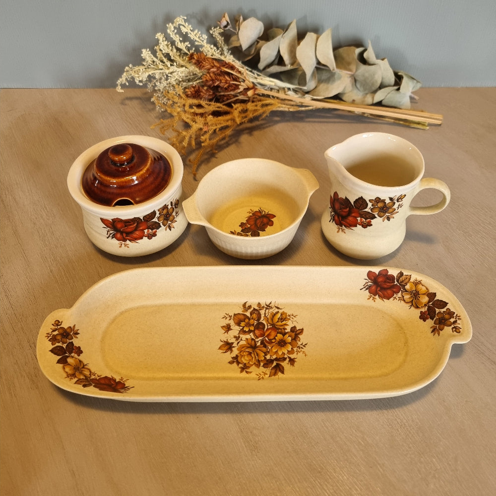 Vintage floral ceramic tea set with tray, jug, bowl and lidded pot.
