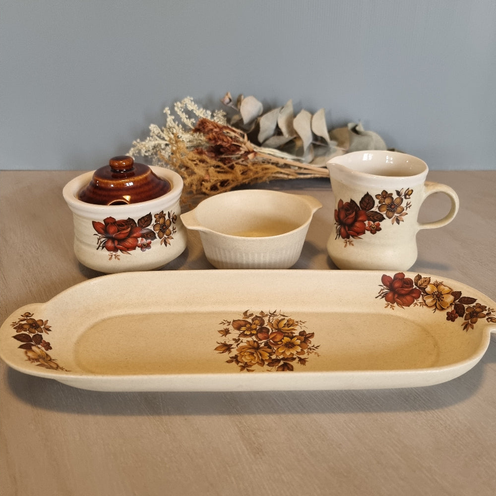 Vintage floral ceramic tea set with tray, jug, bowl and lidded pot.