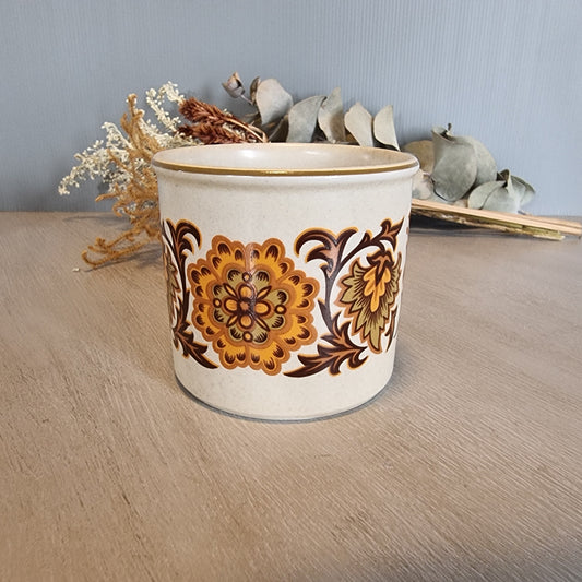 Midwinter English pottery canister with bold 1970s floral pattern.