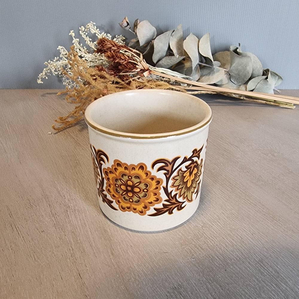 Midwinter English pottery canister with bold 1970s floral pattern.