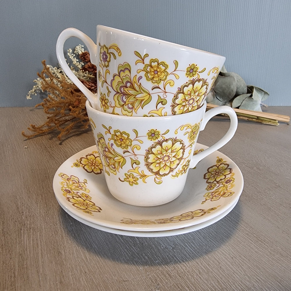 Pair of Royal Vale bone china cups and saucer with vintage floral design.