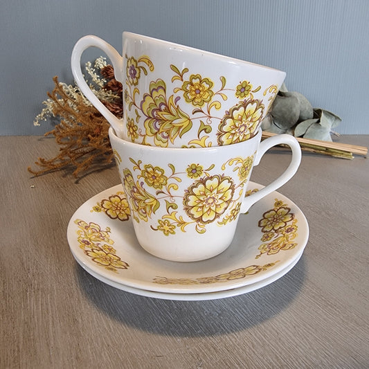 Pair of Royal Vale bone china cups and saucer with vintage floral design.