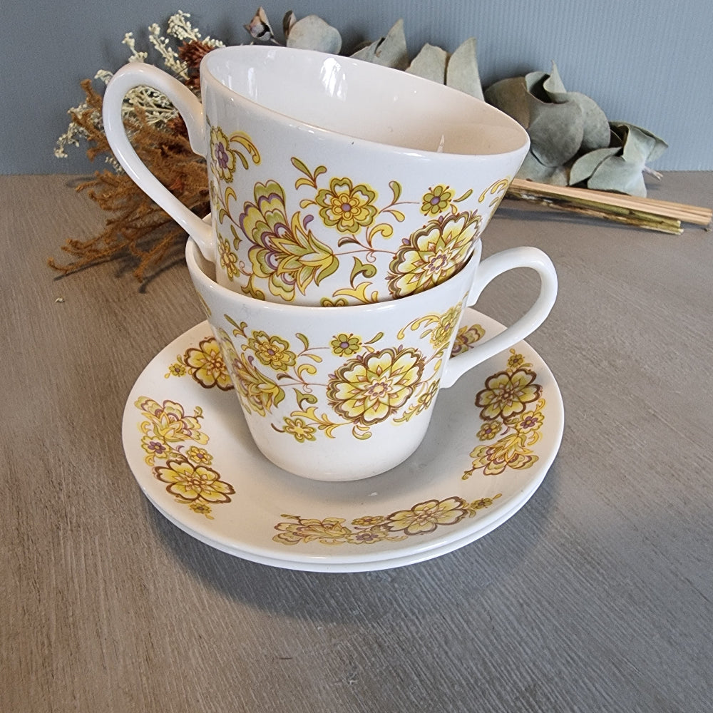 Pair of Royal Vale bone china cups and saucer with vintage floral design.