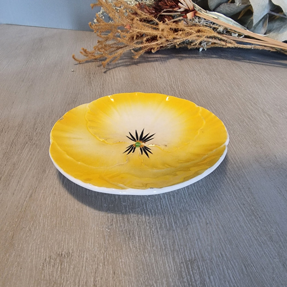 Royal Art Pottery yellow pansy-shaped ceramic dish from England.