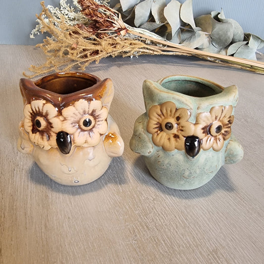 Pair of vintage ceramic owl planters with flower eyes, in cream and green glazes.