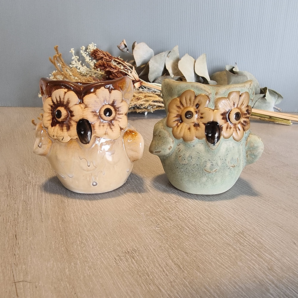 Pair of vintage ceramic owl planters with flower eyes, in cream and green glazes.