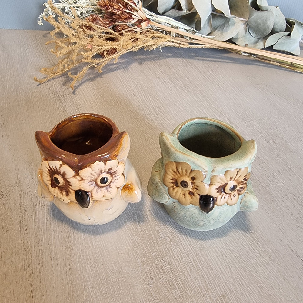Pair of vintage ceramic owl planters with flower eyes, in cream and green glazes.