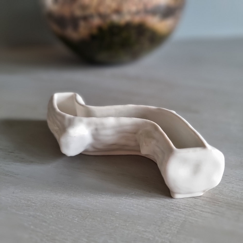 Wade white ceramic log-shaped posy vase with bark texture.