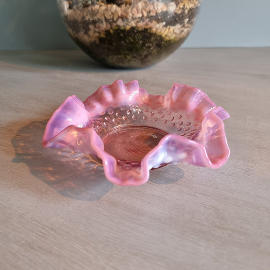 Vintage Fenton pink opalescent hobnail glass bowl with ruffled edge.