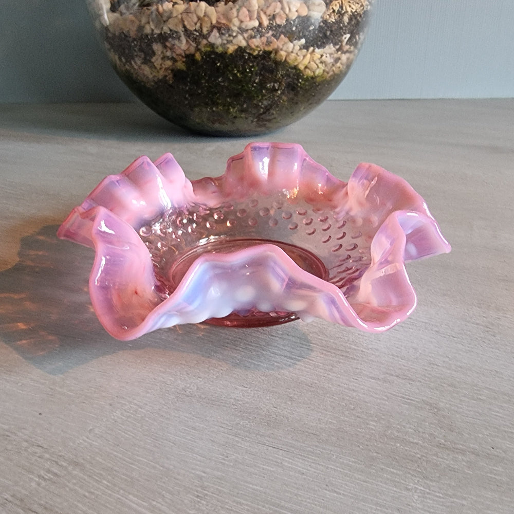 Vintage Fenton pink opalescent hobnail glass bowl with ruffled edge.