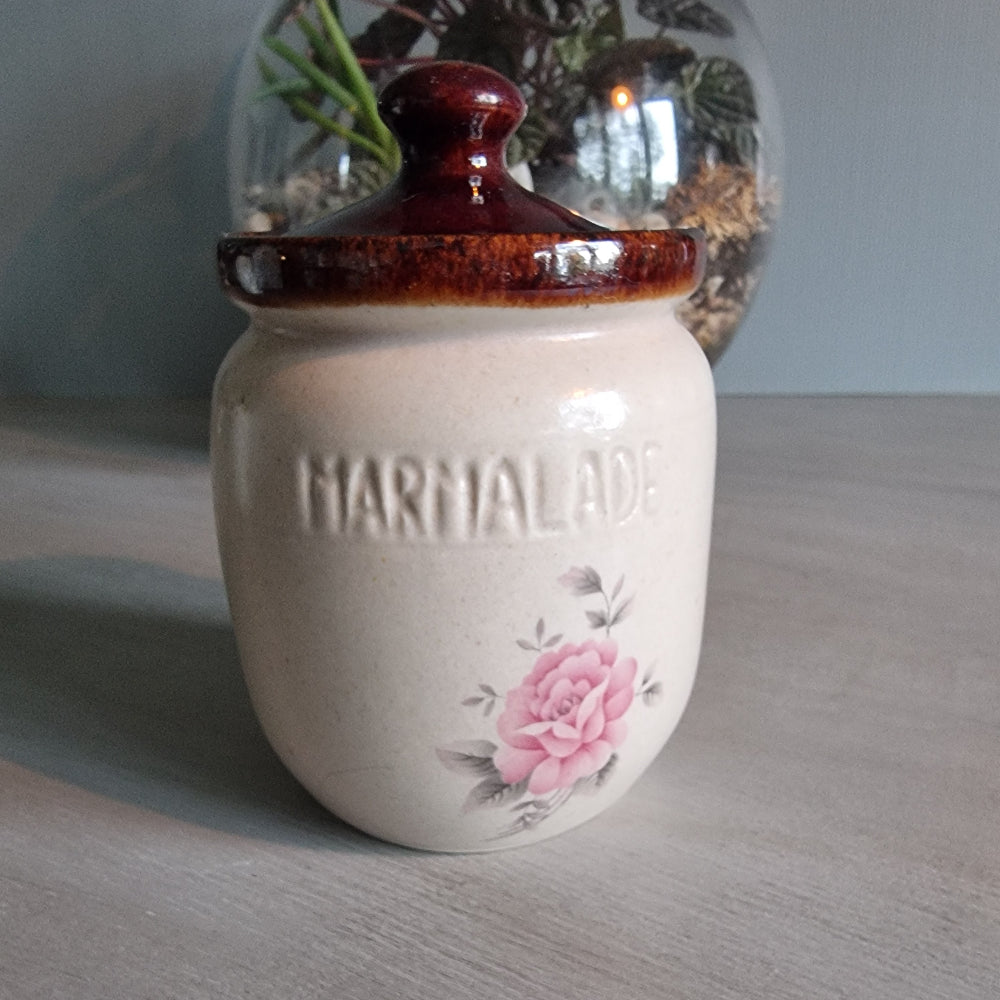 Kermiko Potteries marmalade jar with brown lid and pink floral motif.