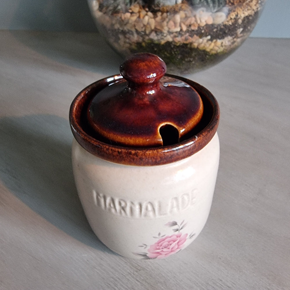 Kermiko Potteries marmalade jar with brown lid and pink floral motif.
