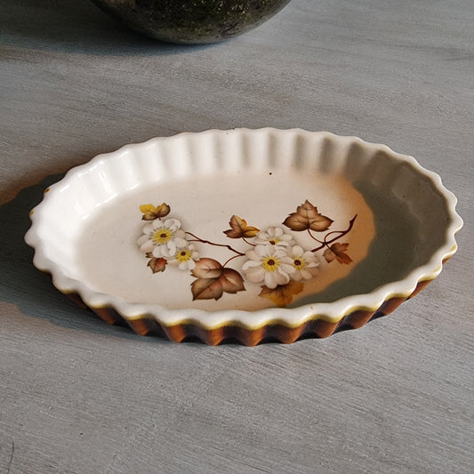 Kermiko Potteries flan dish with floral pattern and scalloped edge.