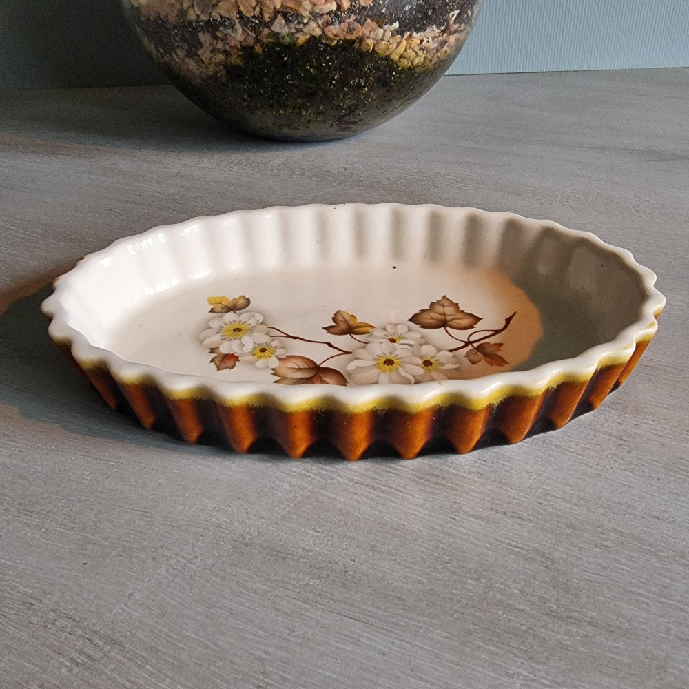 Kermiko Potteries flan dish with floral pattern and scalloped edge.