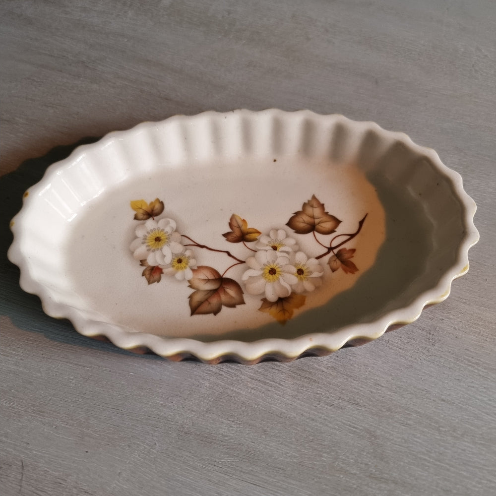 Kermiko Potteries flan dish with floral pattern and scalloped edge.