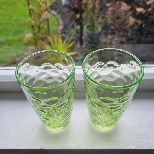 Pair of vintage green optic glass tumblers with bubble design and soft uranium glow.