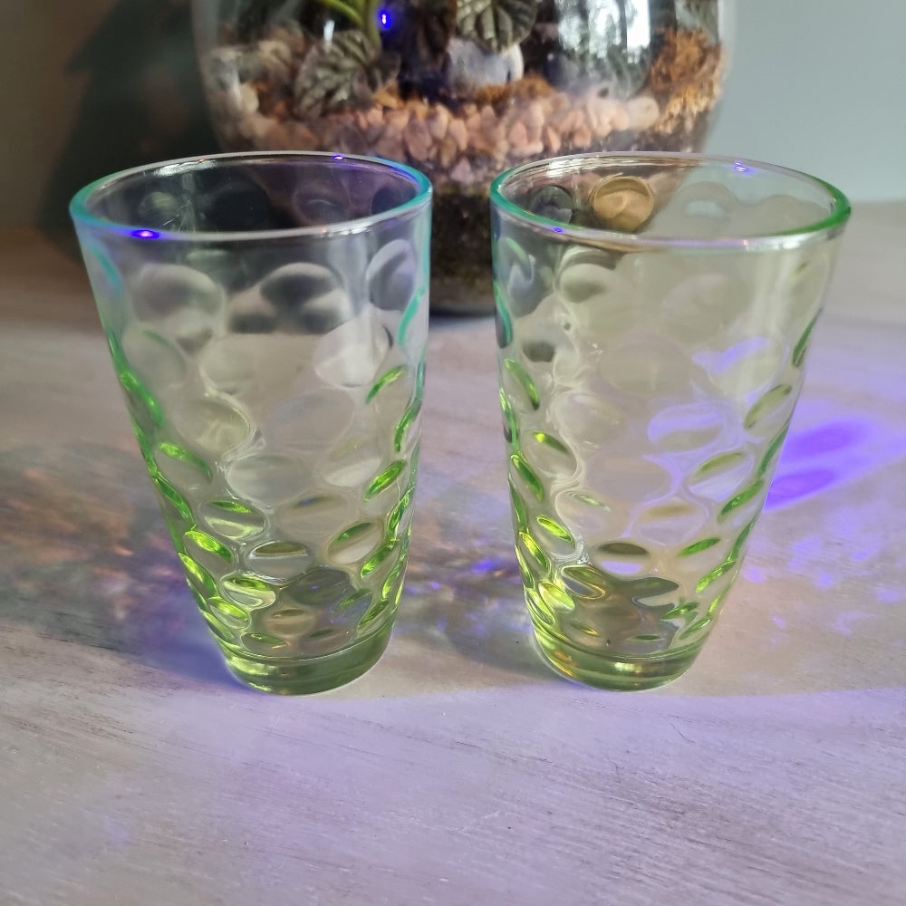Pair of vintage green optic glass tumblers with bubble design and soft uranium glow.