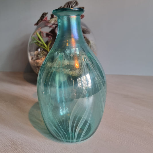Hand-blown teal art glass vase with iridescent finish and feather swirl design.
