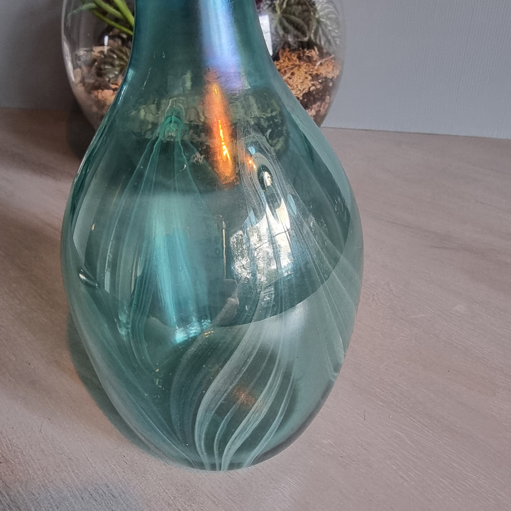 Hand-blown teal art glass vase with iridescent finish and feather swirl design.