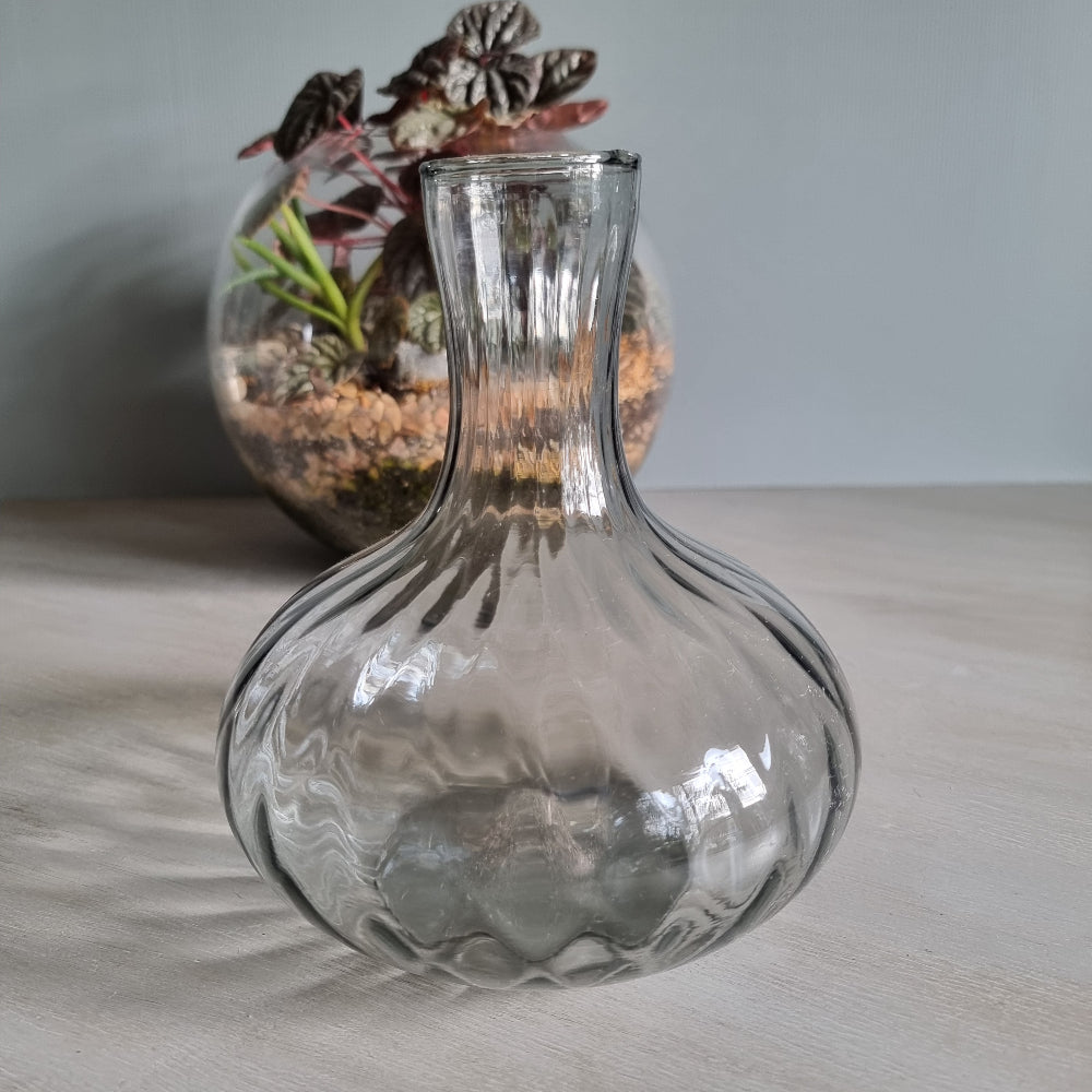 Vintage clear optic glass vase with swirl pattern and fluted neck.