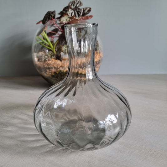 Vintage clear optic glass vase with swirl pattern and fluted neck.