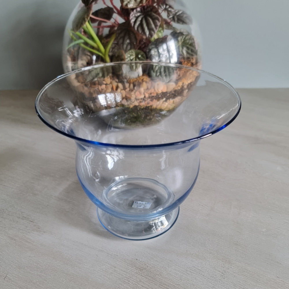 Vintage blue glass vase with flared rim and soft blue tint.
