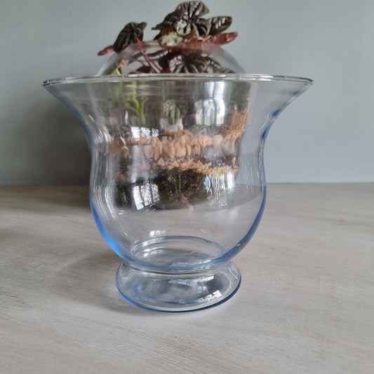 Vintage blue glass vase with flared rim and soft blue tint.