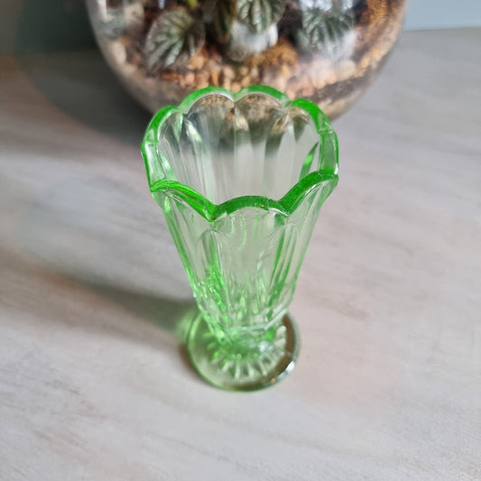 Vintage green Depression glass vase with scalloped rim.