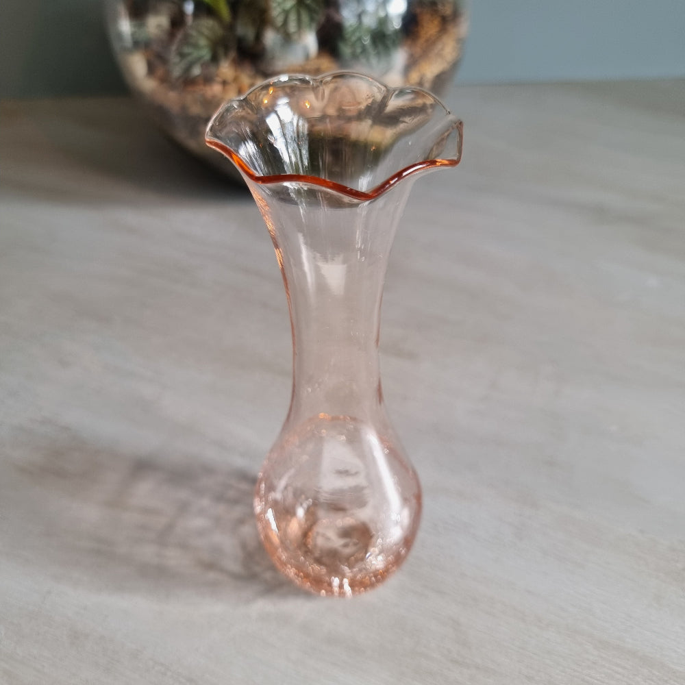 Vintage pink crackle glass bud vase with ruffled rim and soft blush tone.
