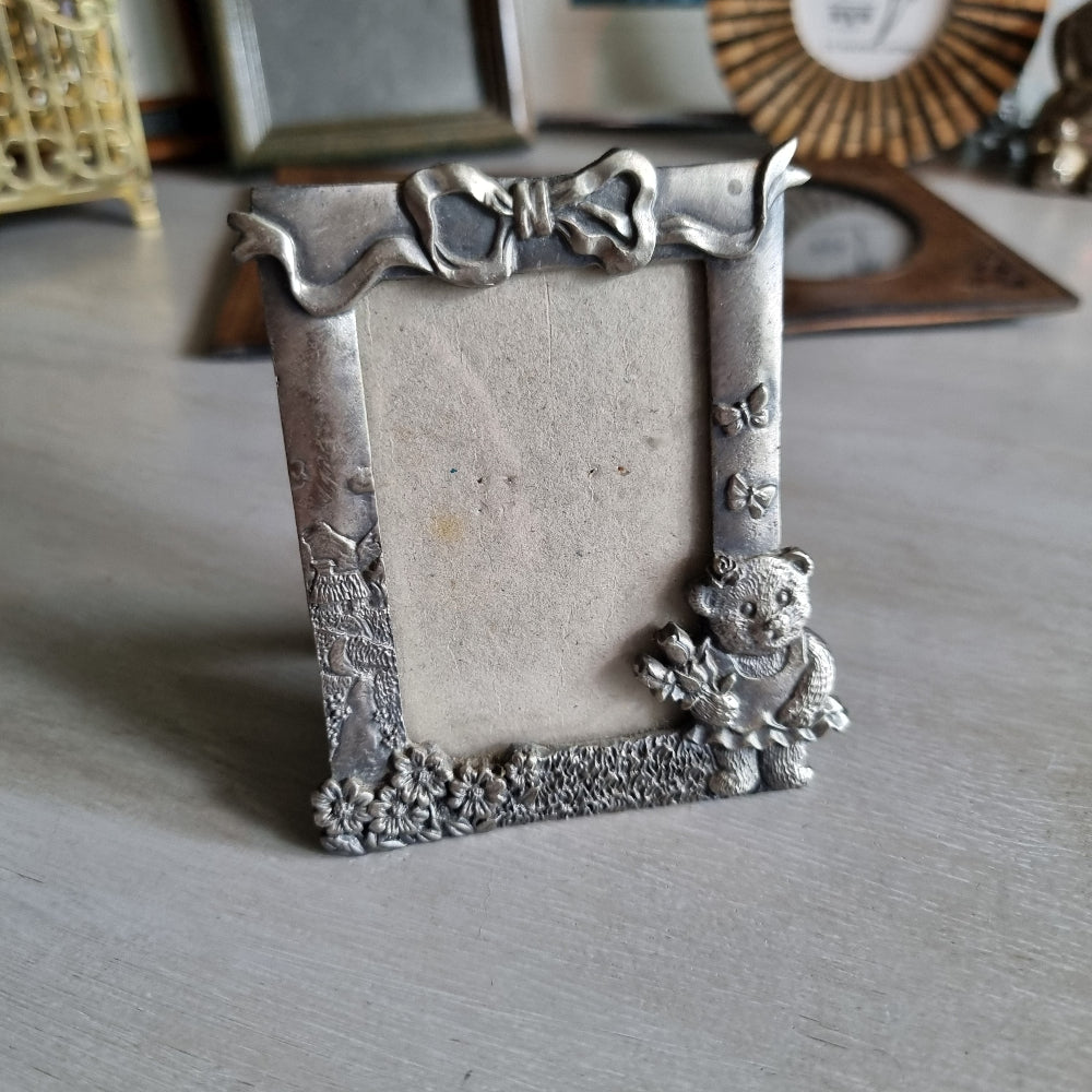 Vintage pewter teddy bear photo frame with bow and butterfly design