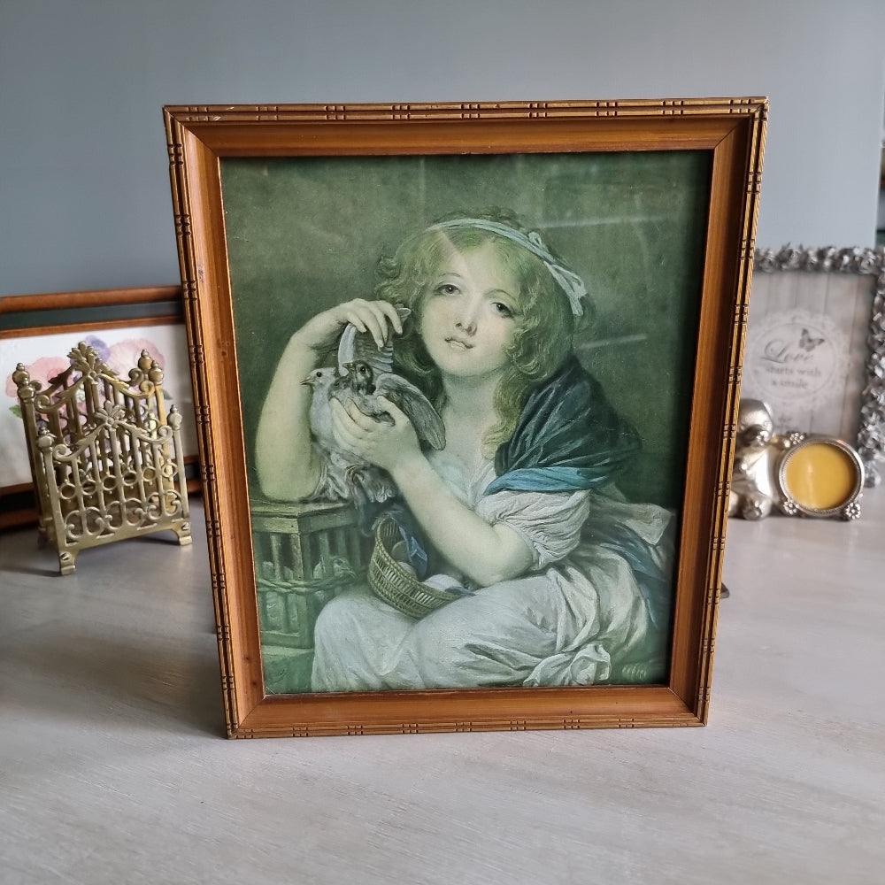 Vintage girl with doves framed print in bamboo-style frame