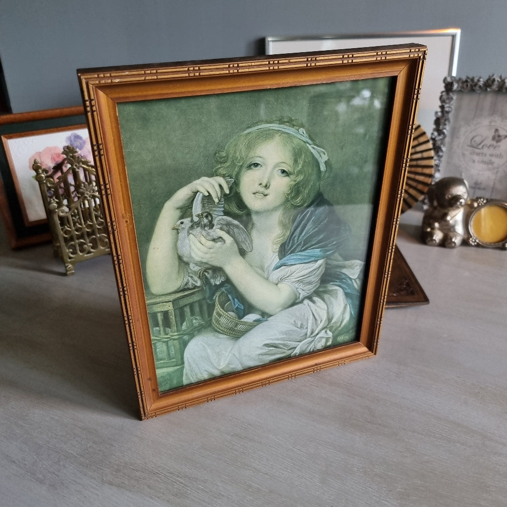 Vintage girl with doves framed print in bamboo-style frame