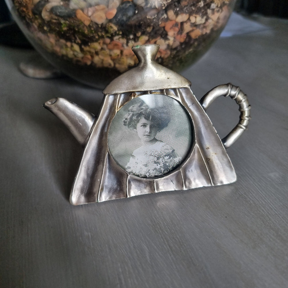 Vintage pewter teapot-shaped photo frame with round window