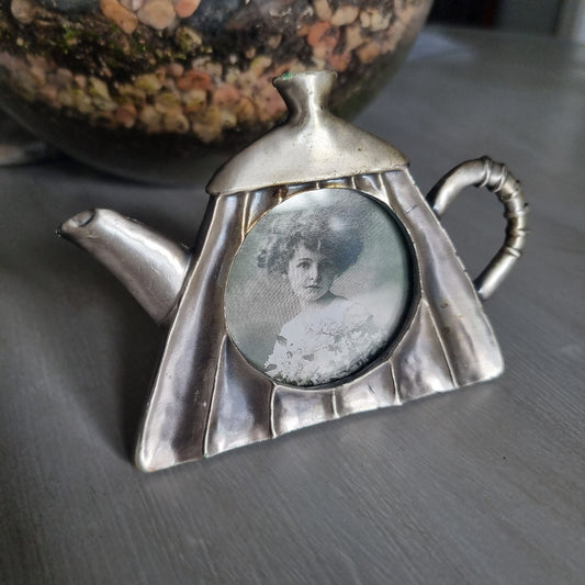 Vintage pewter teapot-shaped photo frame with round window