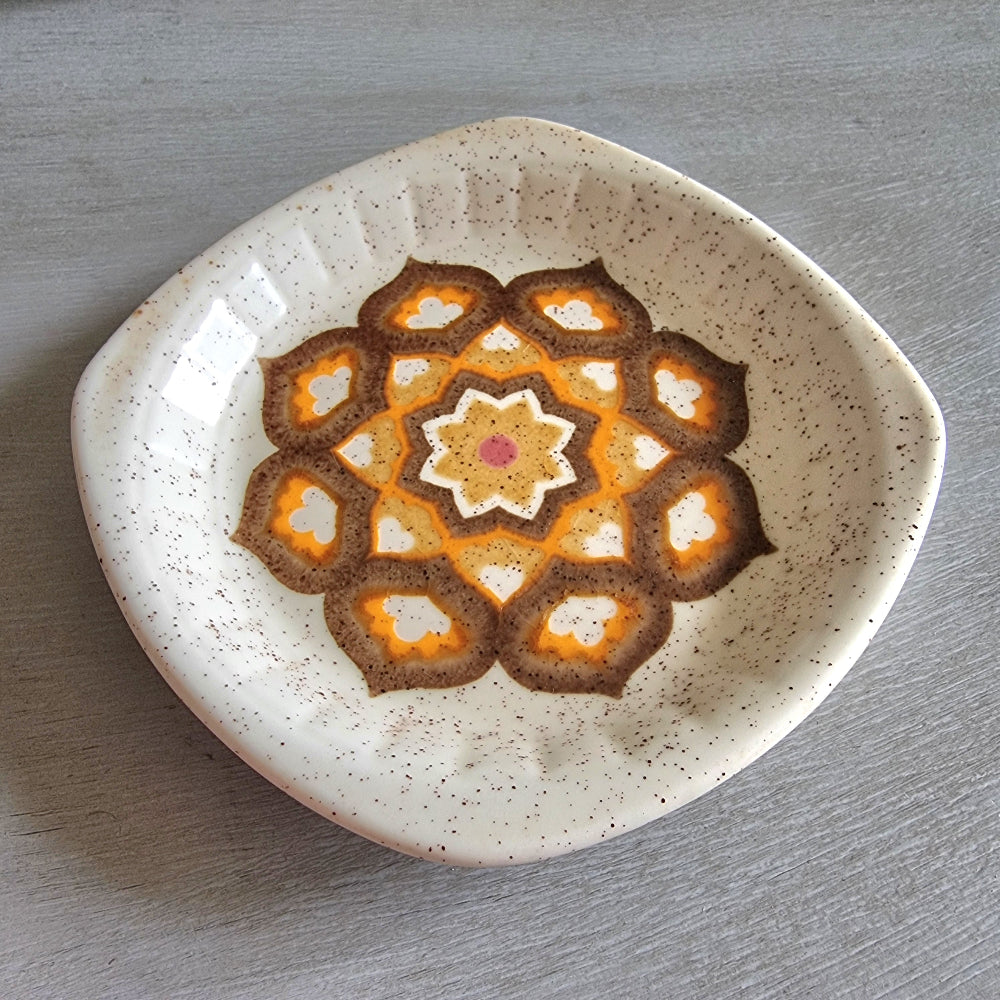 Vintage Palissy geometric dish with orange and brown 70s pattern on speckled glaze.