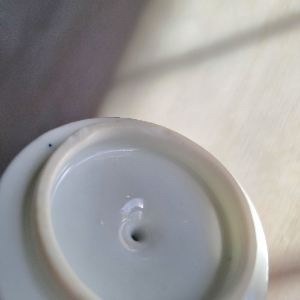 Vintage blue and white twin-handled lidded jar with chinoiserie transferware pattern