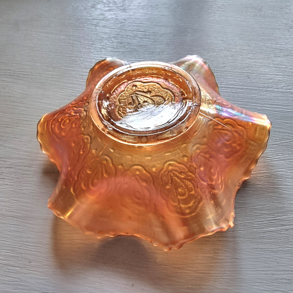 Vintage Fenton Persian Medallion marigold carnival glass bowl with ruffled edges and iridescent finish.