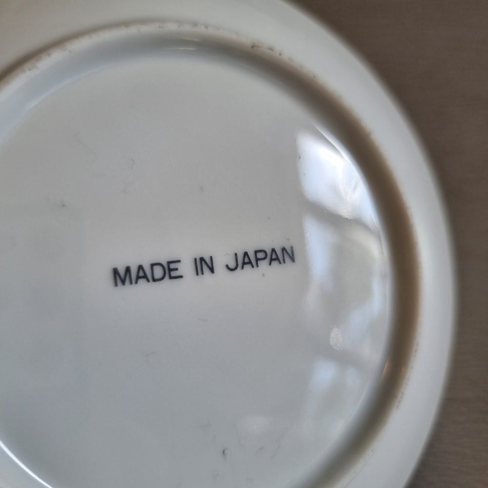 Decorative Japanese porcelain plate with swans and a lotus pond design