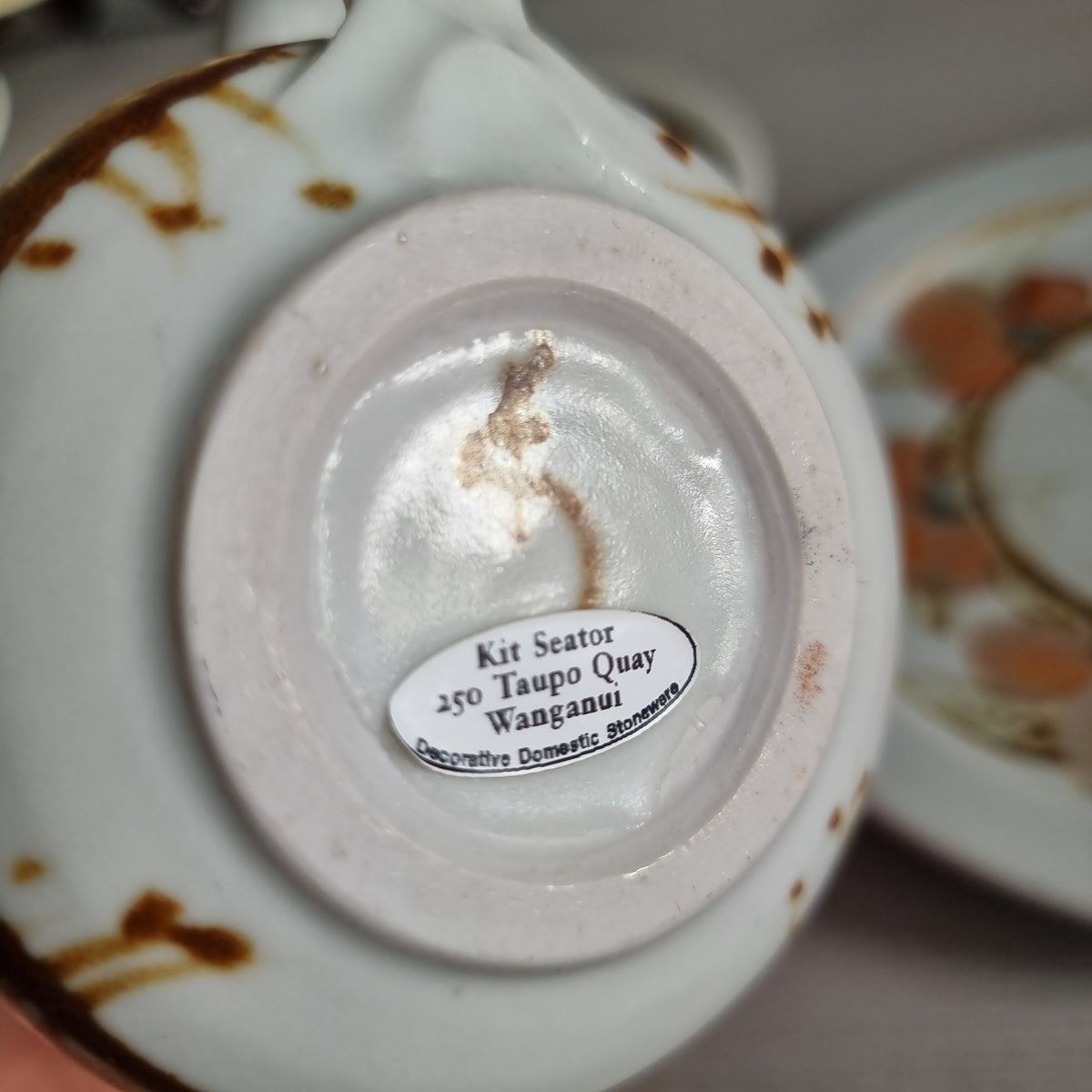Vintage Kit Seator Wanganui stoneware cup, saucer and plate with orange flowers and brown banding
